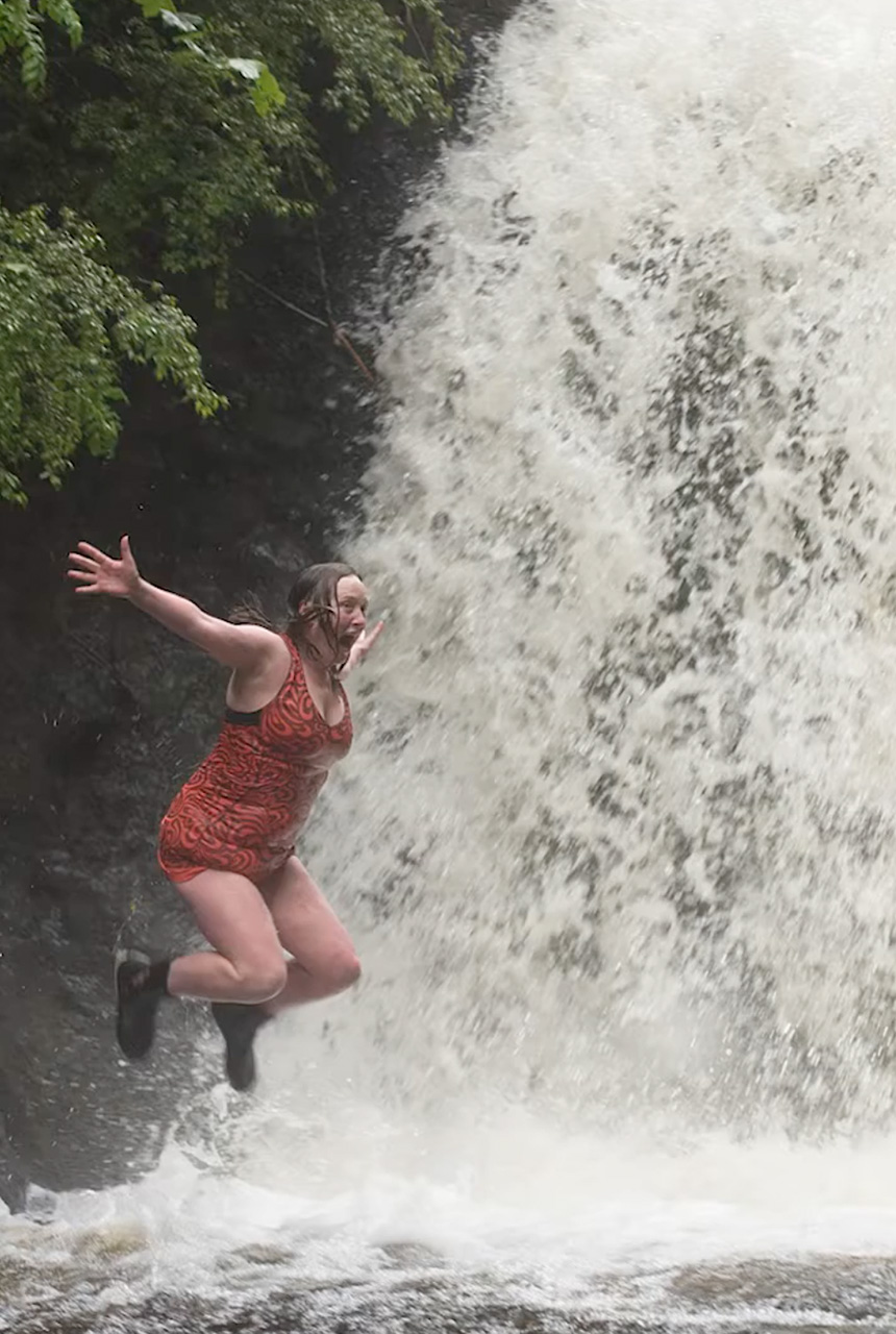 Vicky allen jumping into a waterfall