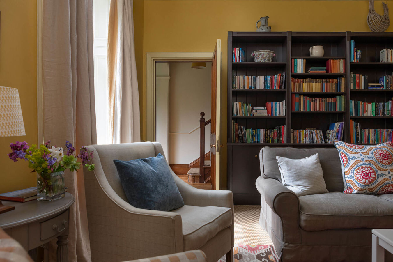 Northumberland Holiday home Wild Plum Crookham Eastfield Farmhouse view of the cosy Library